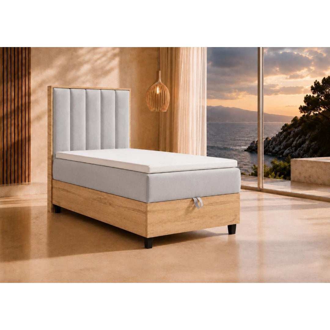 Ein Bettkasten trifft auf weiche Polster an dem Boxspringbett